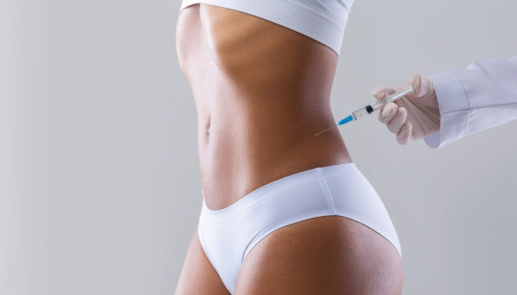 Cropped of black woman having injection in her waist