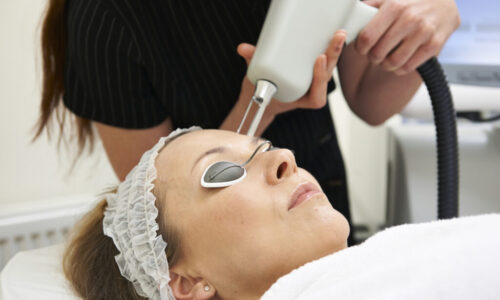 Beautician Carrying Out Fractional Laser Treatment
